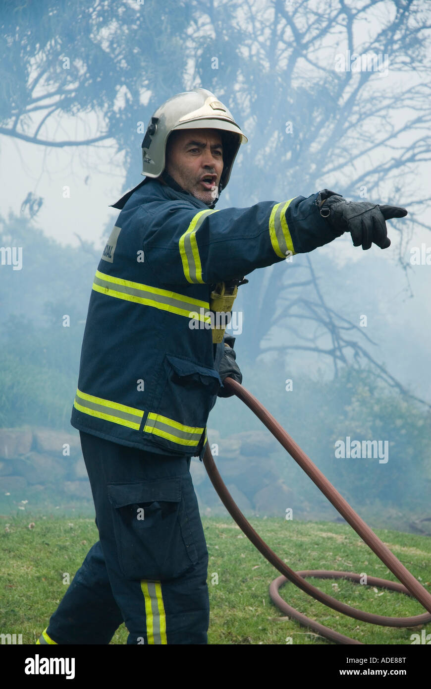 Fireman in action Stock Photo - Alamy