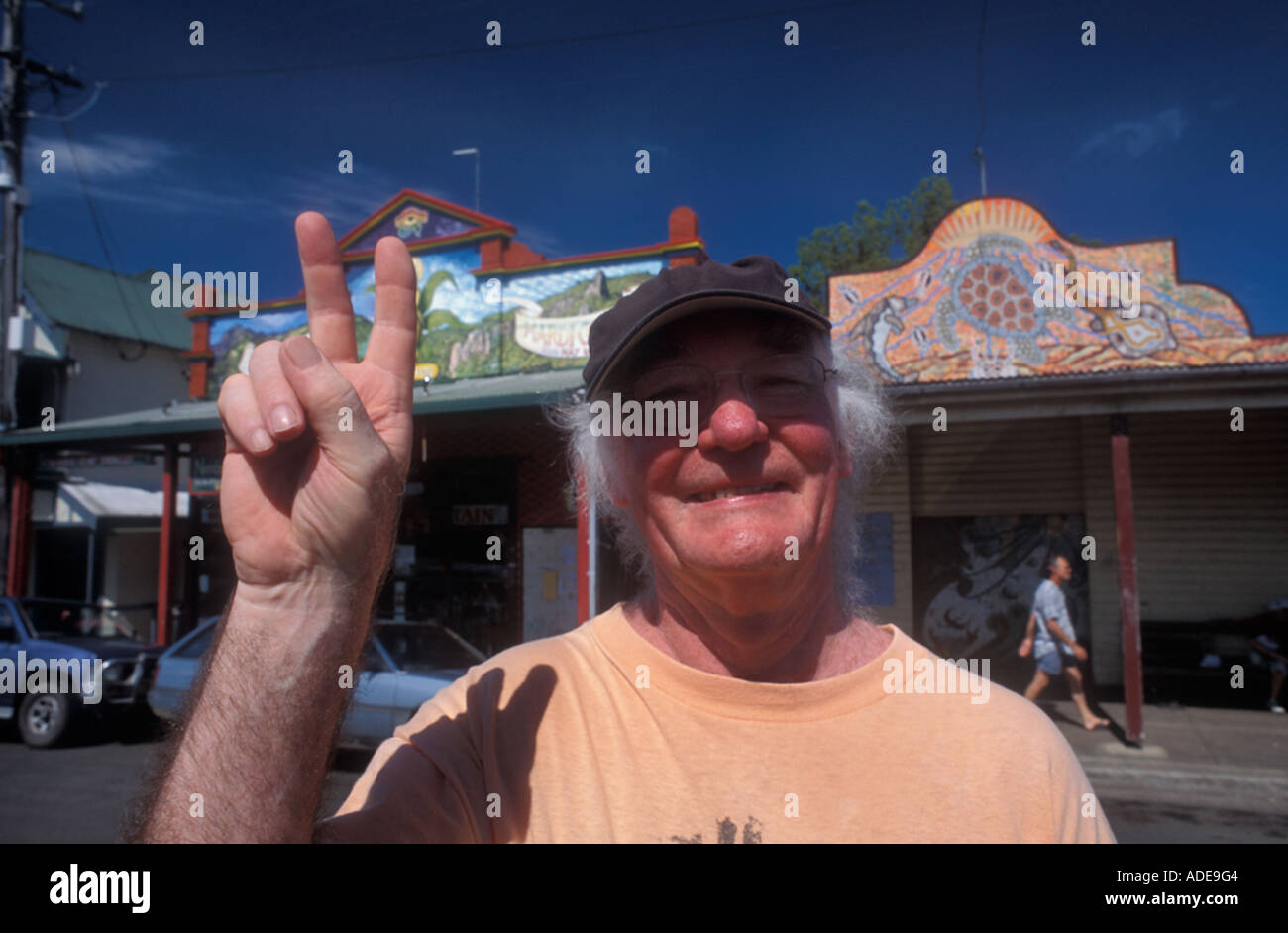 Old hippy giving peace sign , Nimbin , N.S.W Australia Stock Photo
