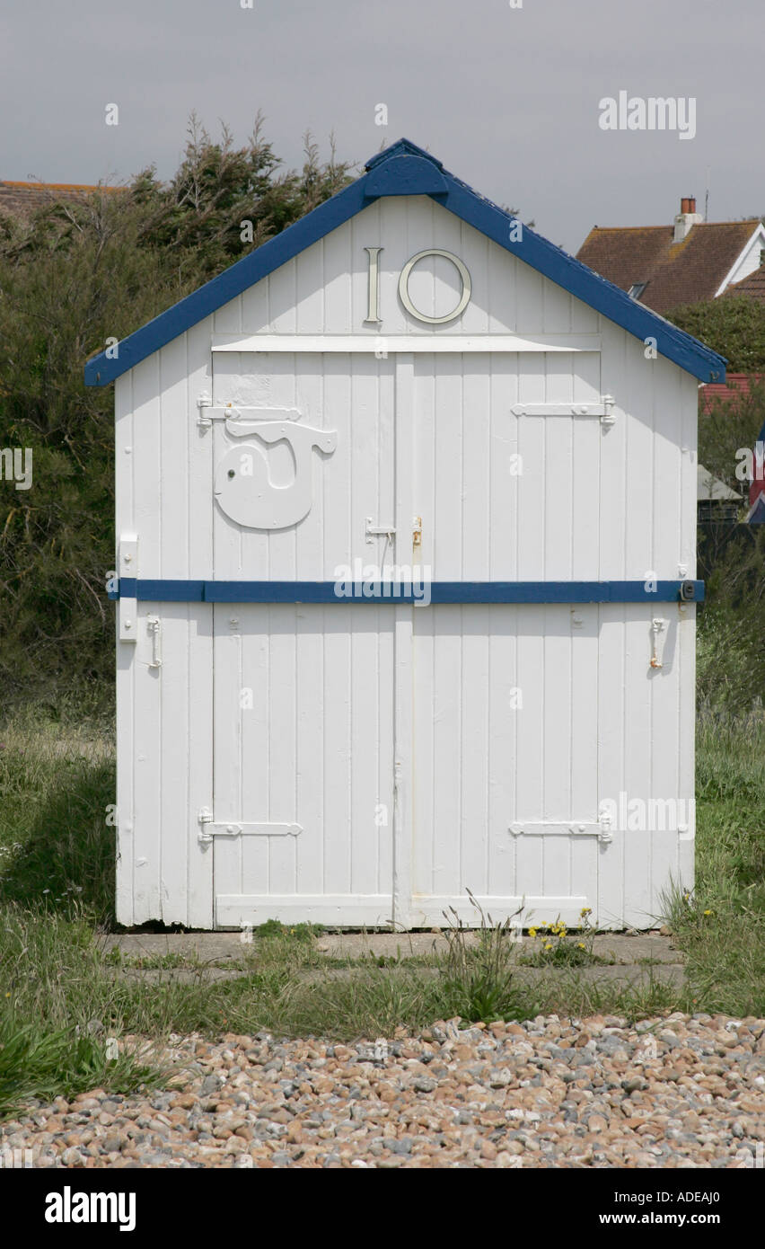White painted beach hut by the sea at Worthing, West Sussex Stock Photo