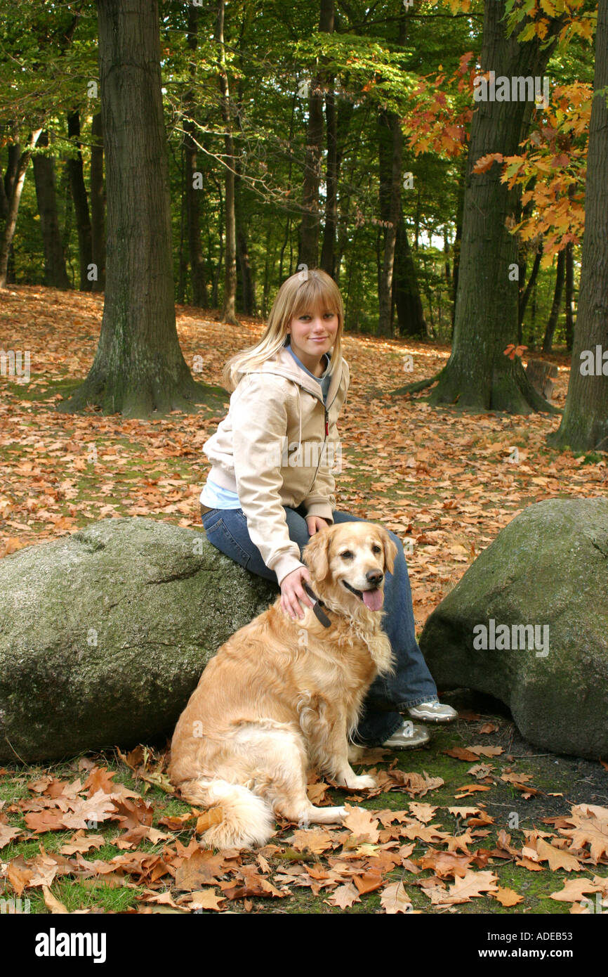 Young girl 16 golden retriever in autumn park setting Stock Photo - Alamy