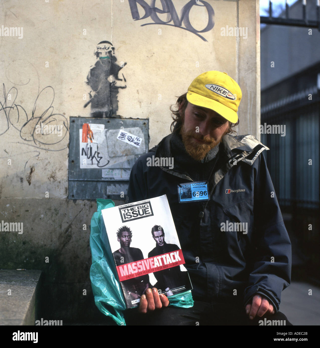 A Big Issue seller holding the magazine cover with Massive Attack band on the South Bank in London England UK  KATHY DEWITT Stock Photo