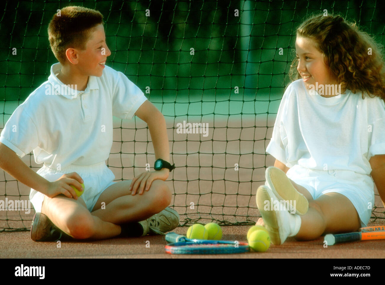 Two kids discussing after tennis math on tennis court Stock Photo Alamy
