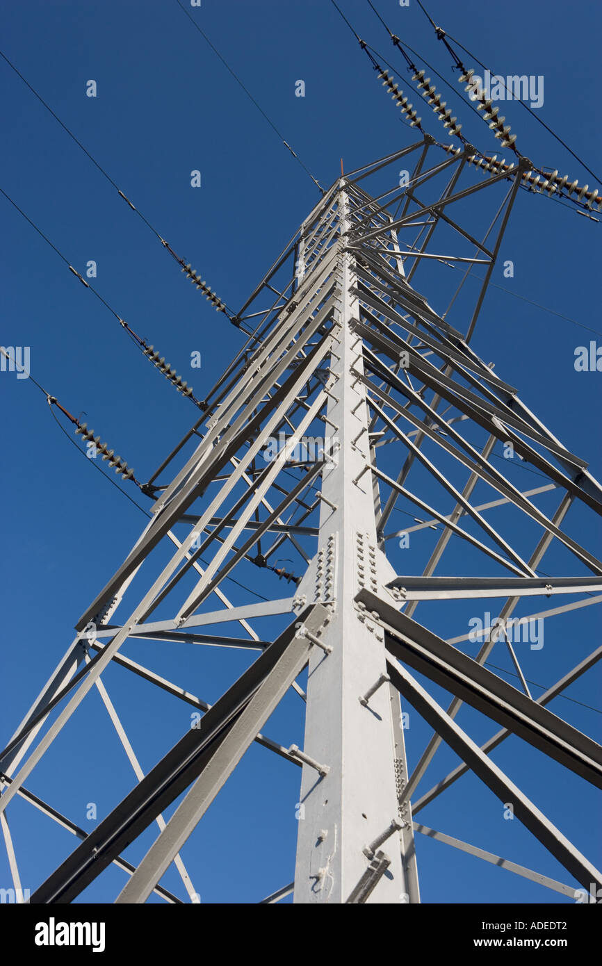 Electricity pylon against blue sky Stock Photo - Alamy