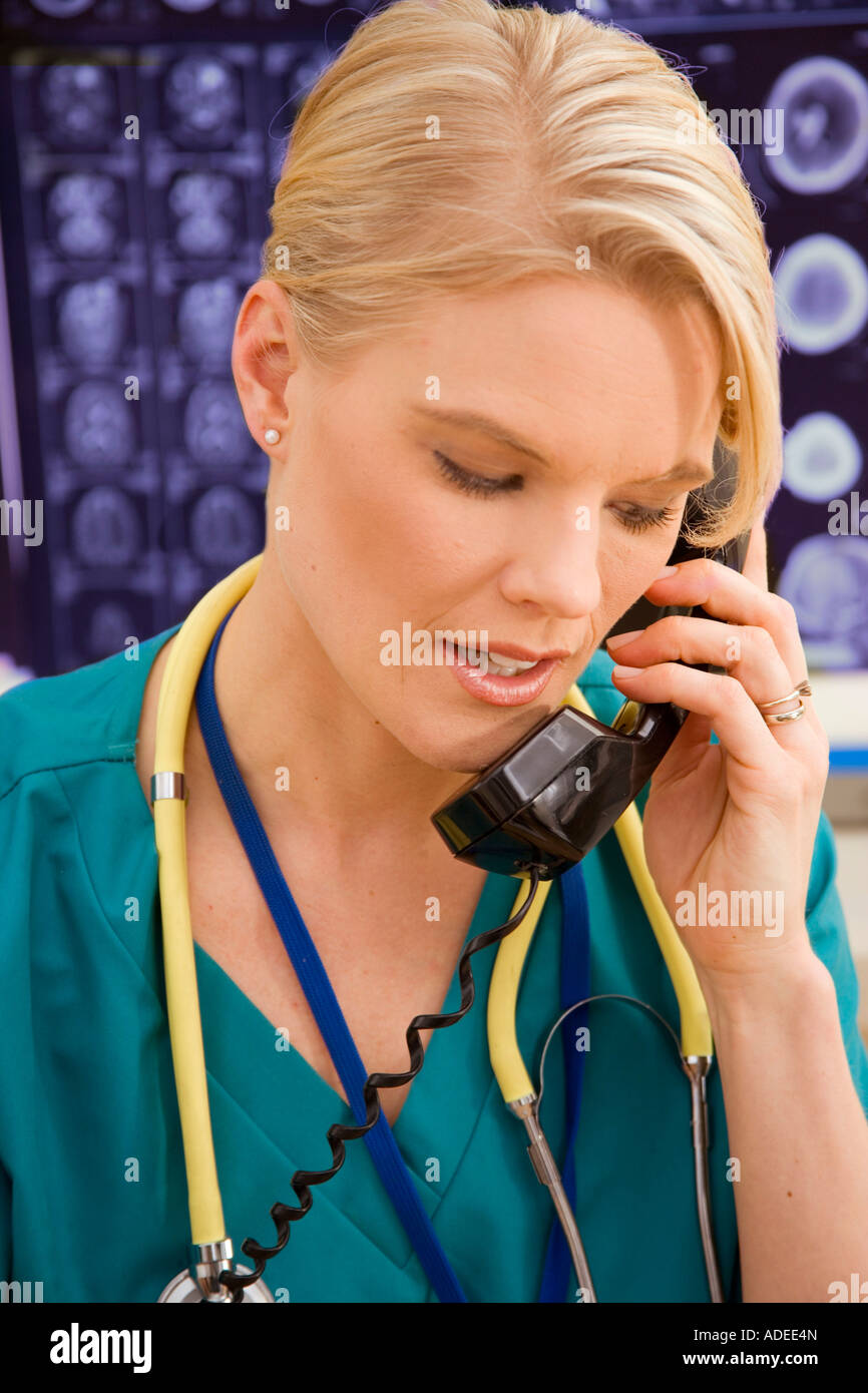 Nurse helps a patient via the telephone. Stock Photo
