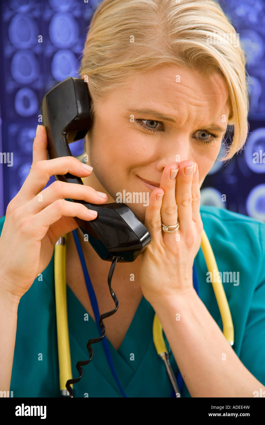 Nurse is sadden as she listens to hard news Stock Photo Alamy