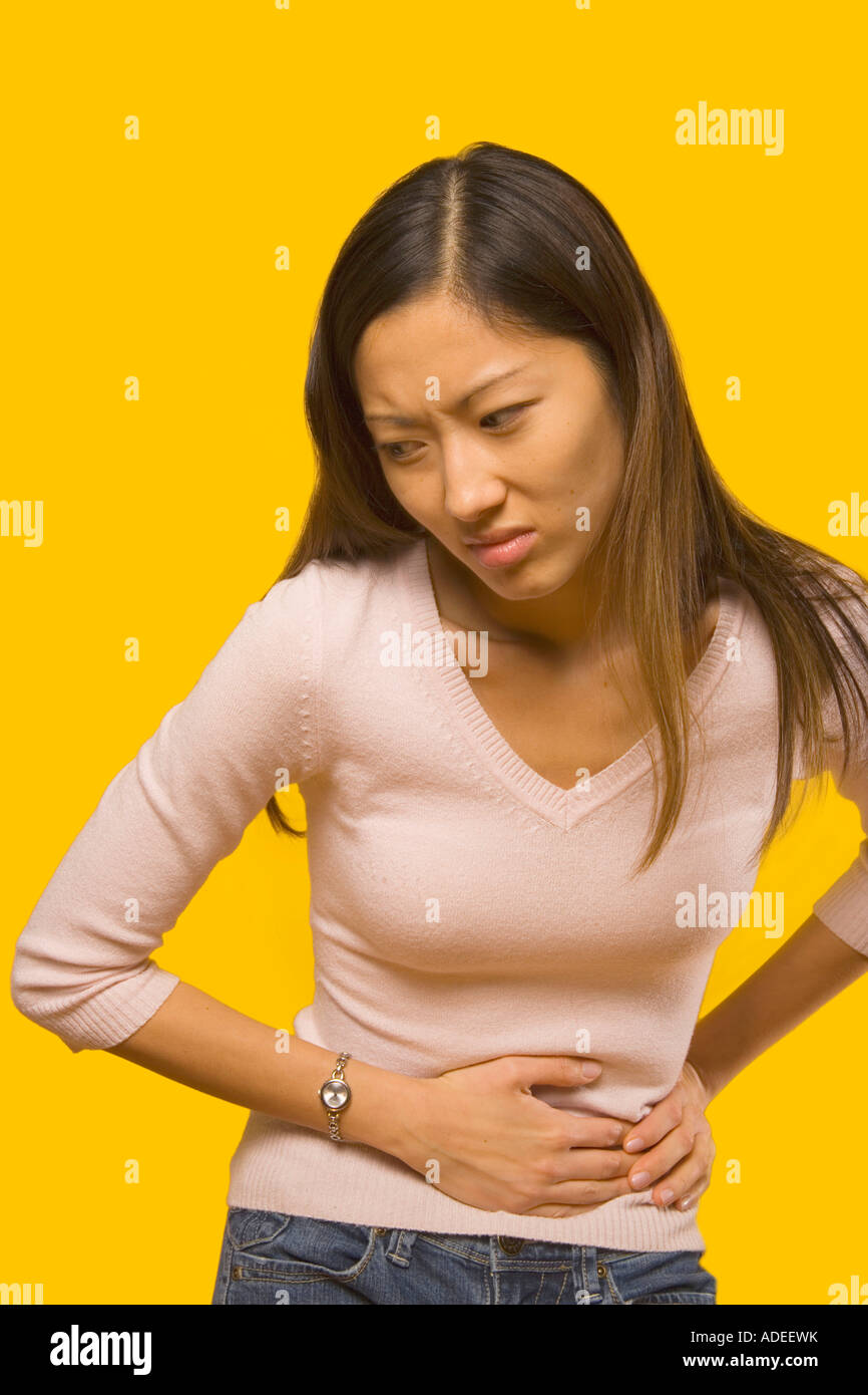 Young woman with stomach pain Stock Photo Alamy