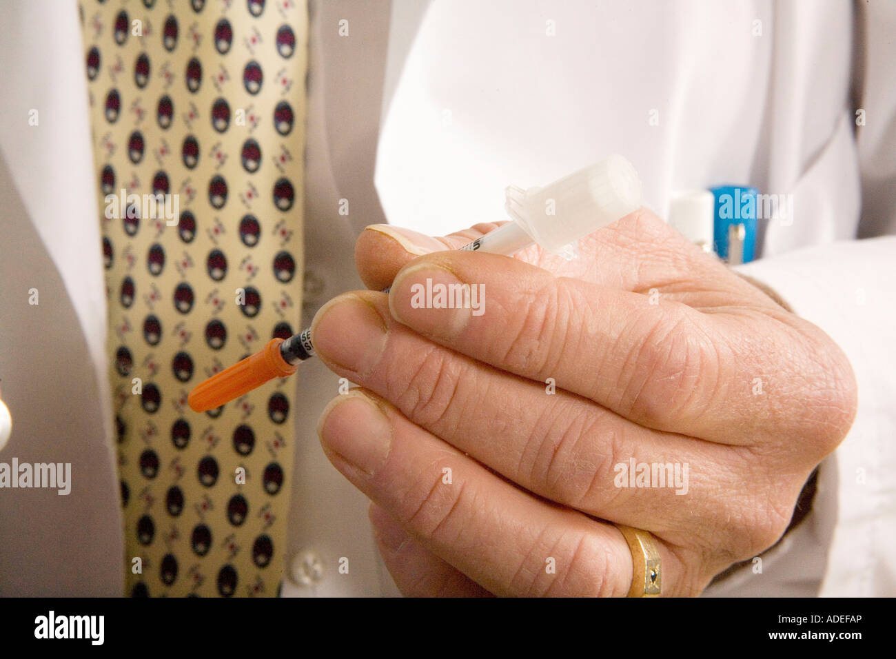 Doctor or patient holds a syringe used by diabetics for insulin