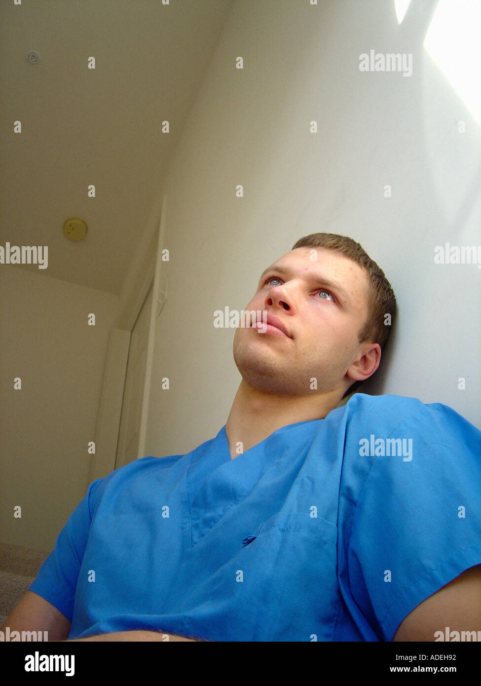 Portrait of a Male Doctor Medical Professional of Eastern European Ethnicity Wearing Blue Surgical Scrubs Stock Photo