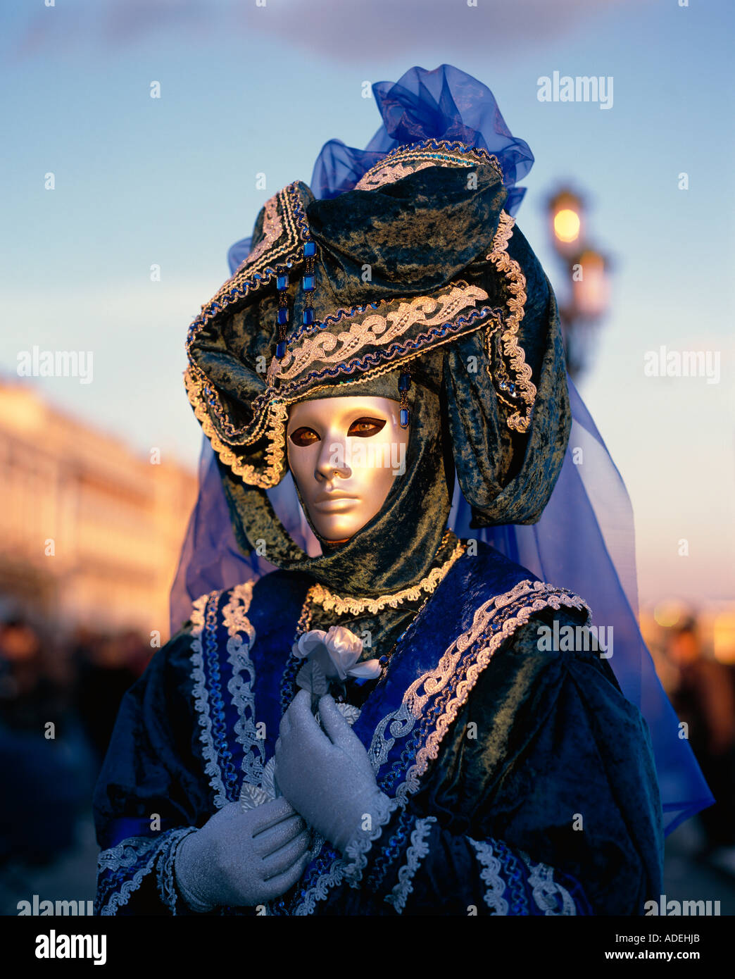 Italy Venice Carnival. Woman wearing face mask and costume. Stock Photo