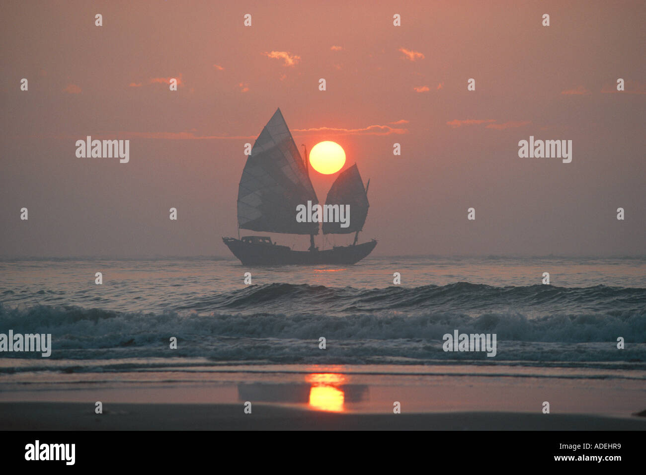China. Guangdong (Canton). Shantou area. Dezhou Island. Early morning view of Chinese trading junk sailboat off the coast. Stock Photo