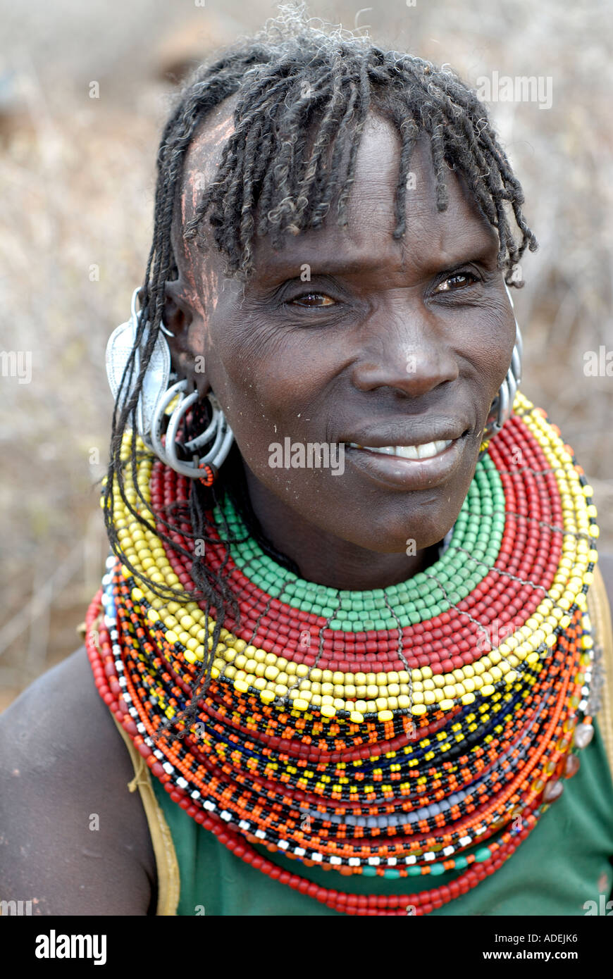 Smiling Turkana woman with traditional hair style and ornaments Northern  Kenya Stock Photo - Alamy