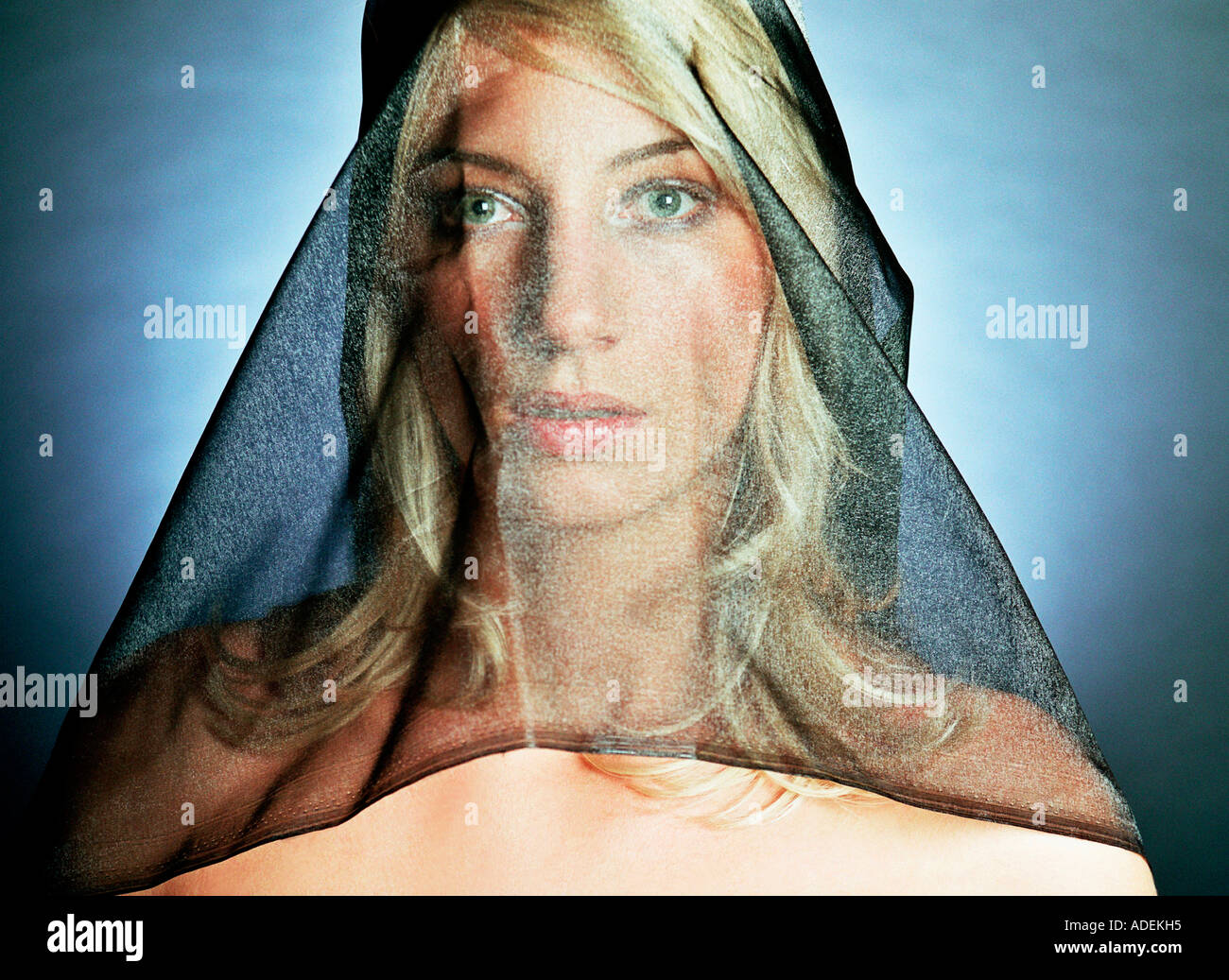 Studio portrait of young blond woman wearing black veil Stock Photo - Alamy