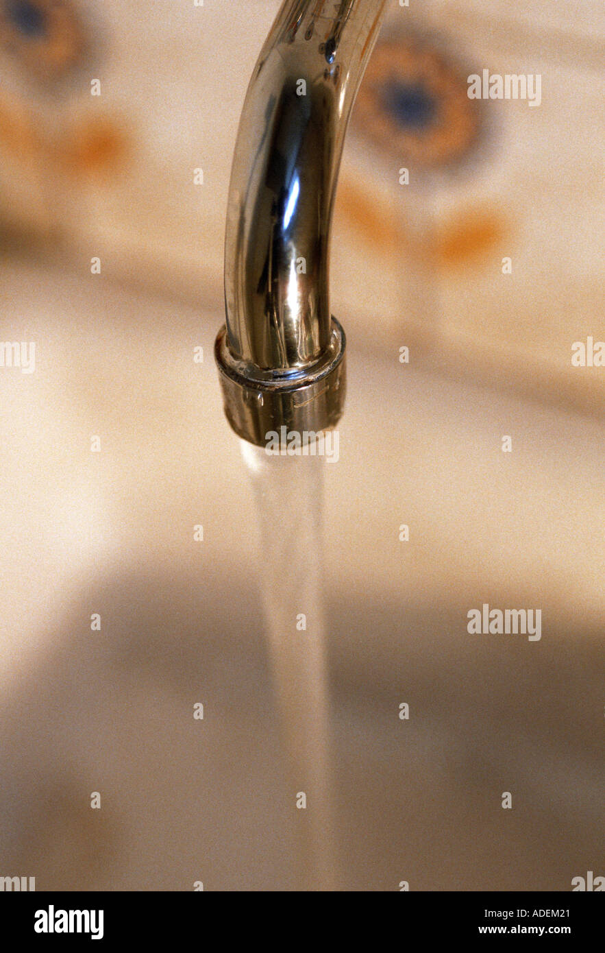an old tap turned on in the kitchen Stock Photo Alamy