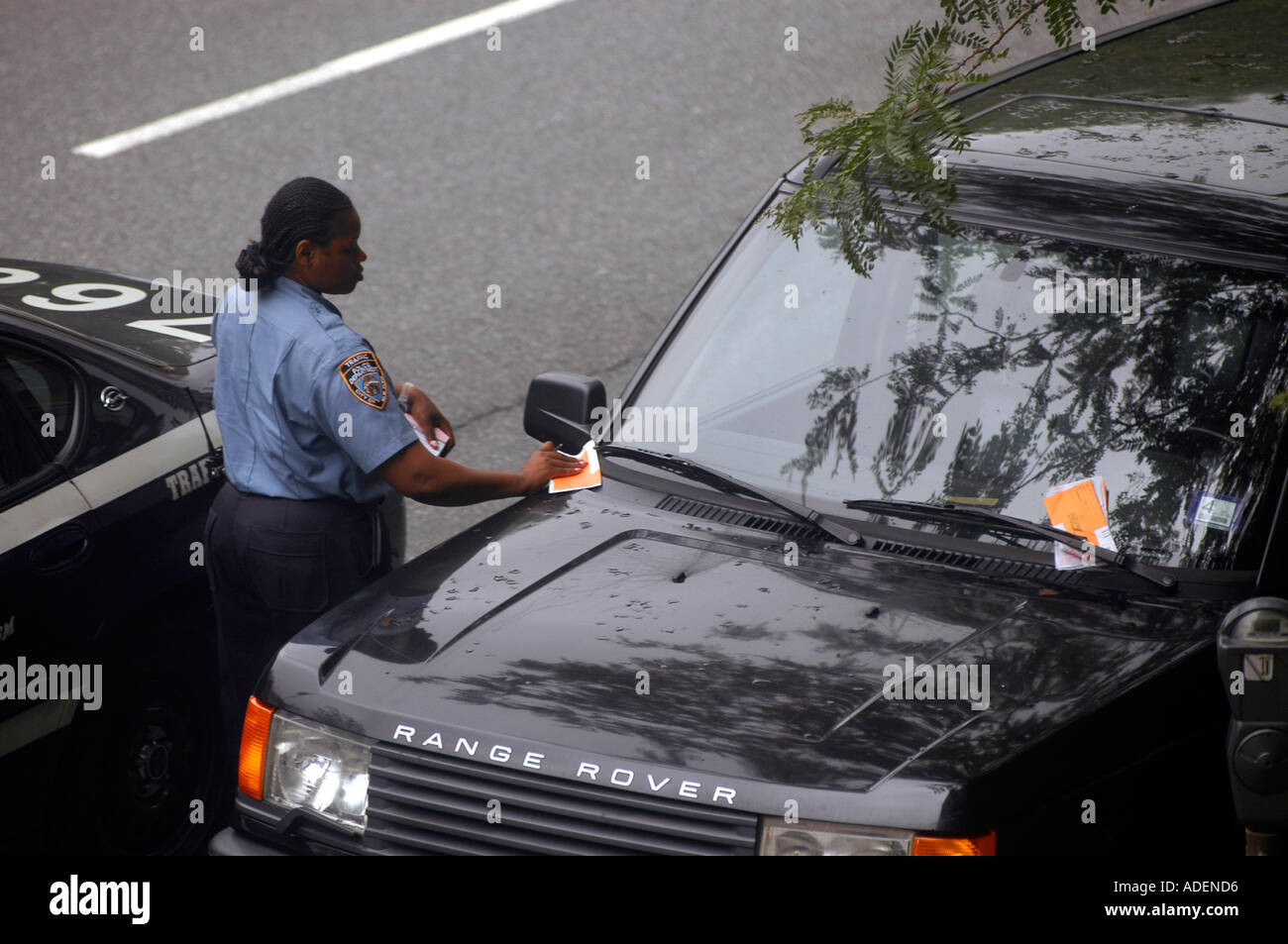 NYPD Traffic enforcement agent delivers parking ticket to a Range Stock