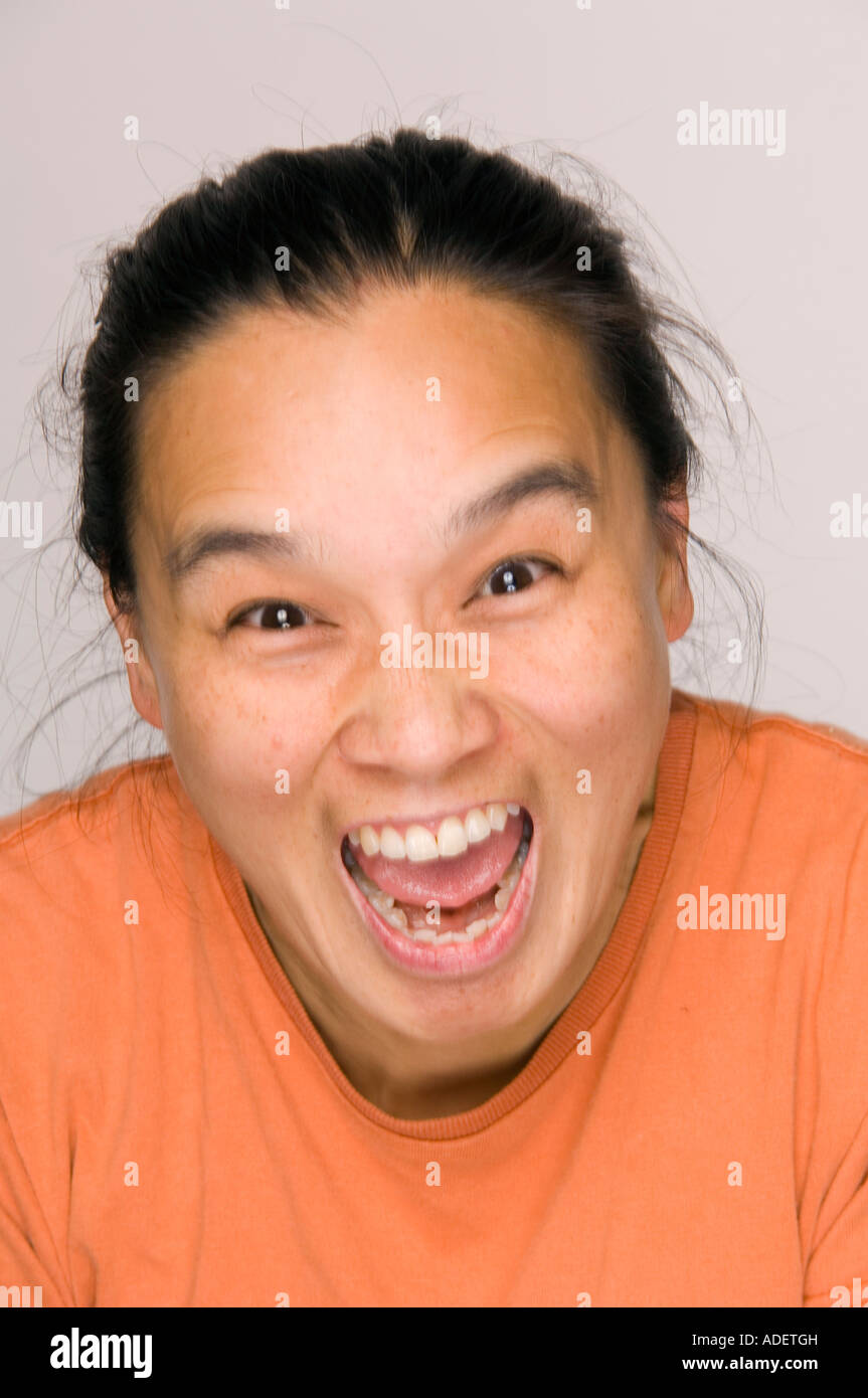 Vibrant Asian woman yelling. Stock Photo