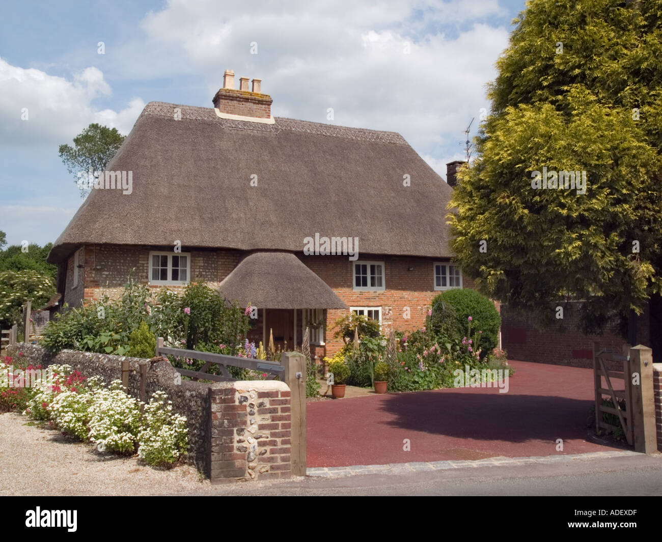 Old thatched cottage house front in Walberton village, West Sussex