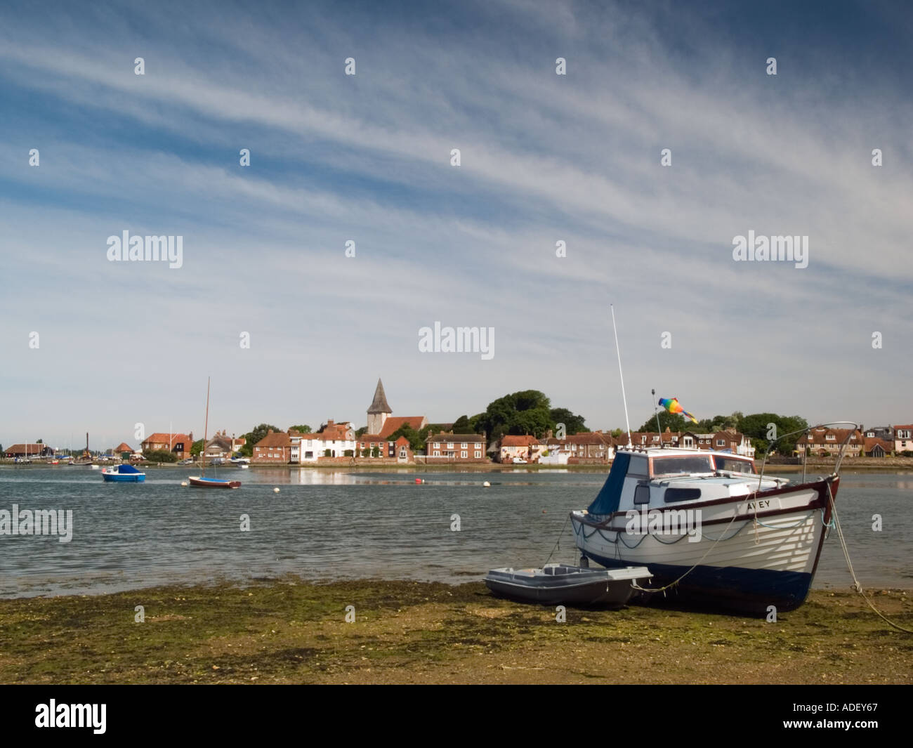 BOATS IN BOSHAM CREEK near HIGH TIDE with the village beyond Bosham