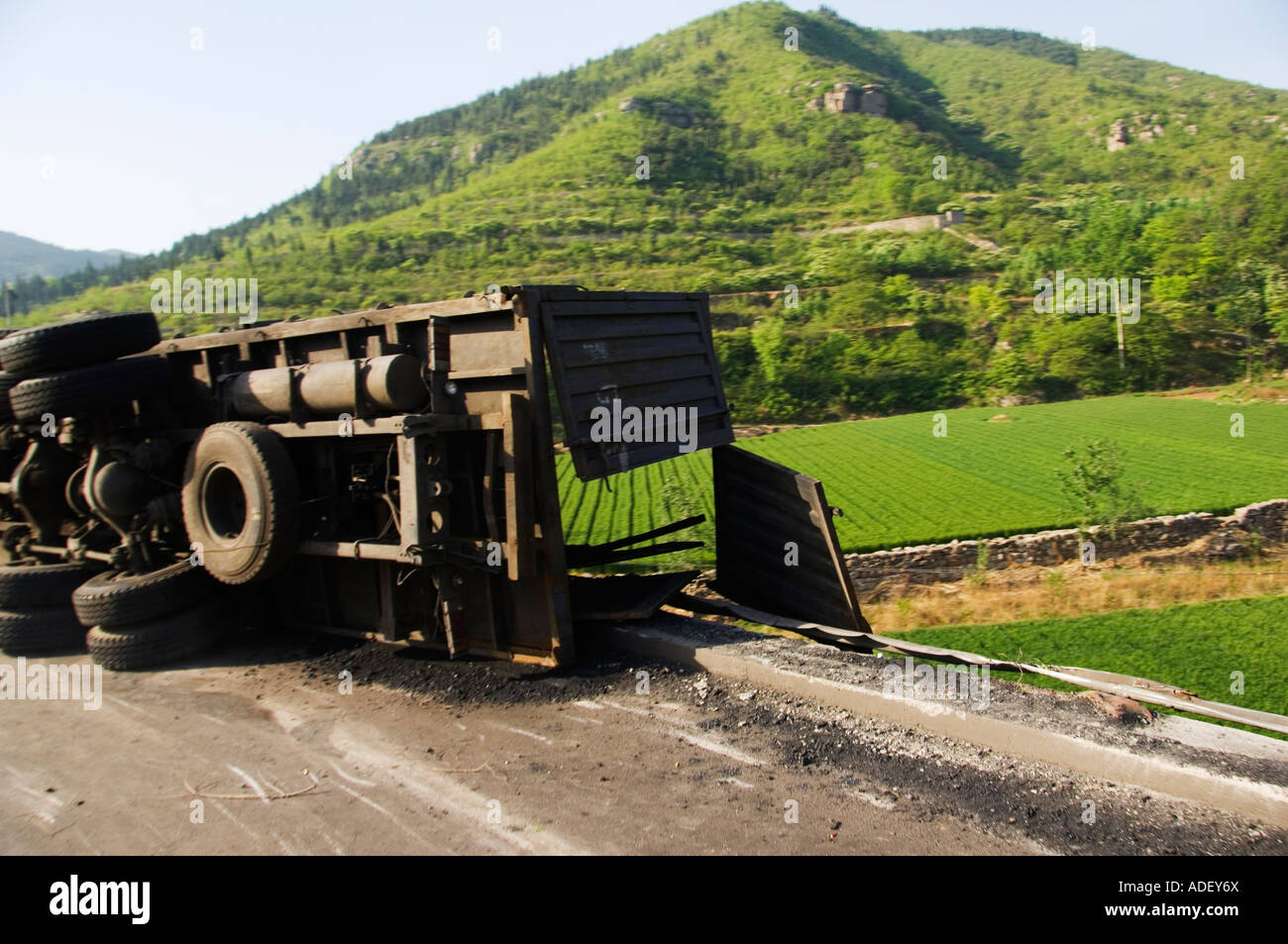 An overturned truck on a country road Henan Province China Stock Photo