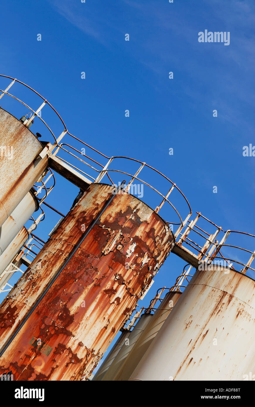 Corroded and corroding chemical storage vessels in a chemical plant complex Stock Photo