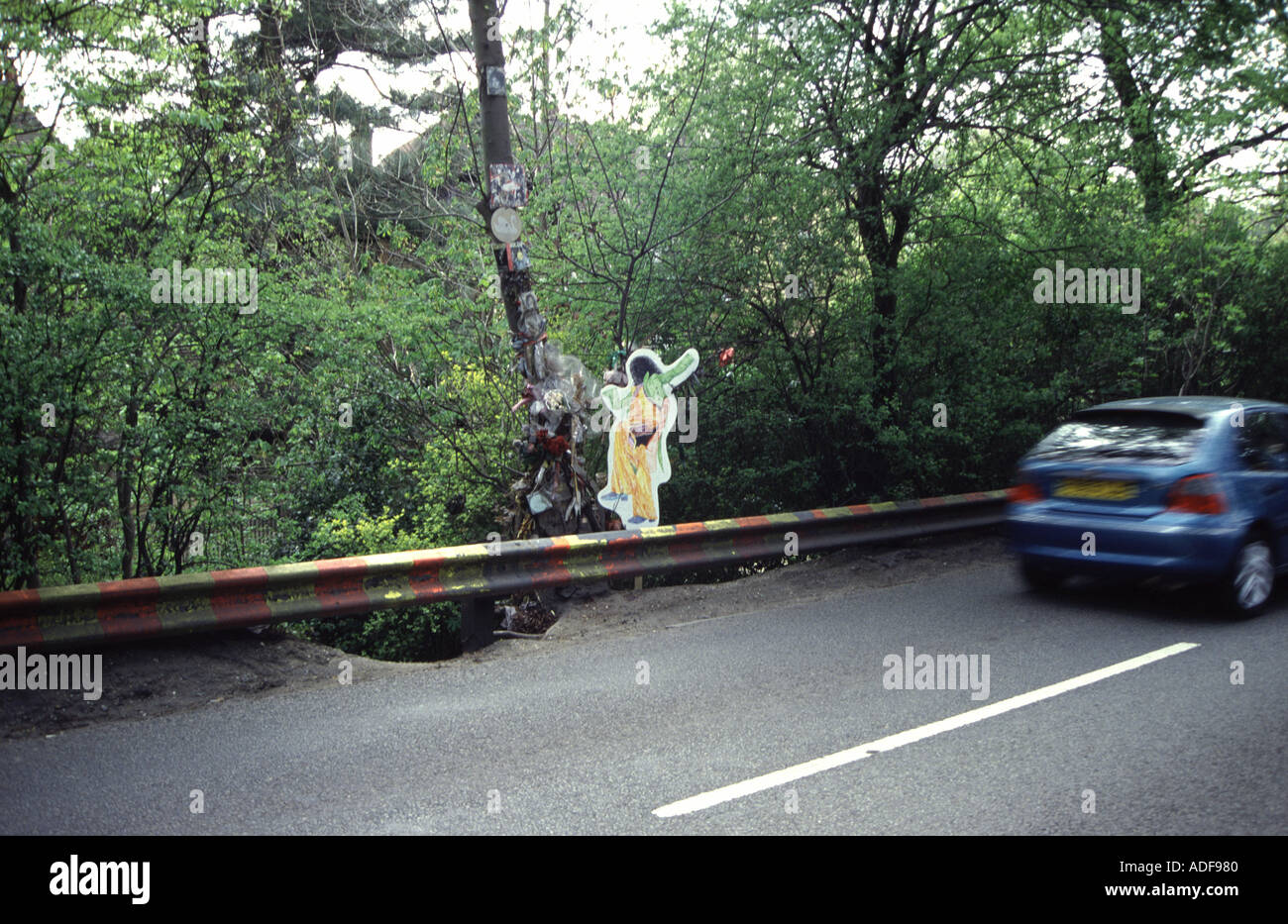 Site where Marc Bolan died when his car crashed into the tree in Queens Ride Barnes in London Tree is decorated by fans Stock Photo