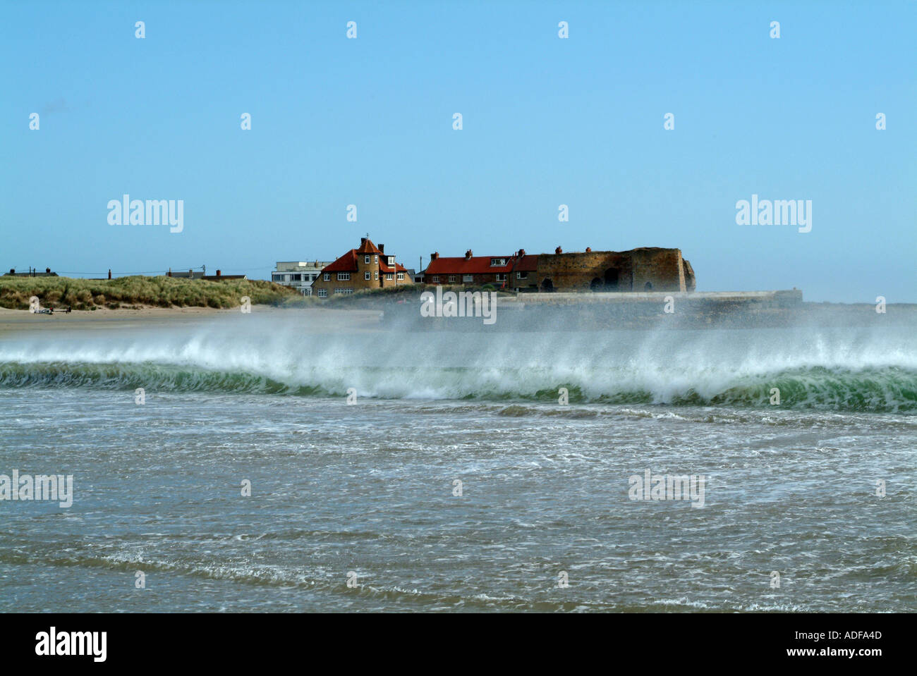 Waves and Spray on North Sea at Beadnell Bay and Harbour Nortumberland England United Kngdom UK Stock Photo