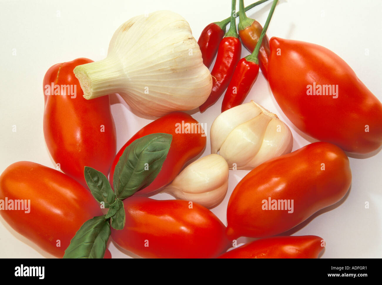 Onion tomatoes basil garlic chilli peppers Italy Stock Photo