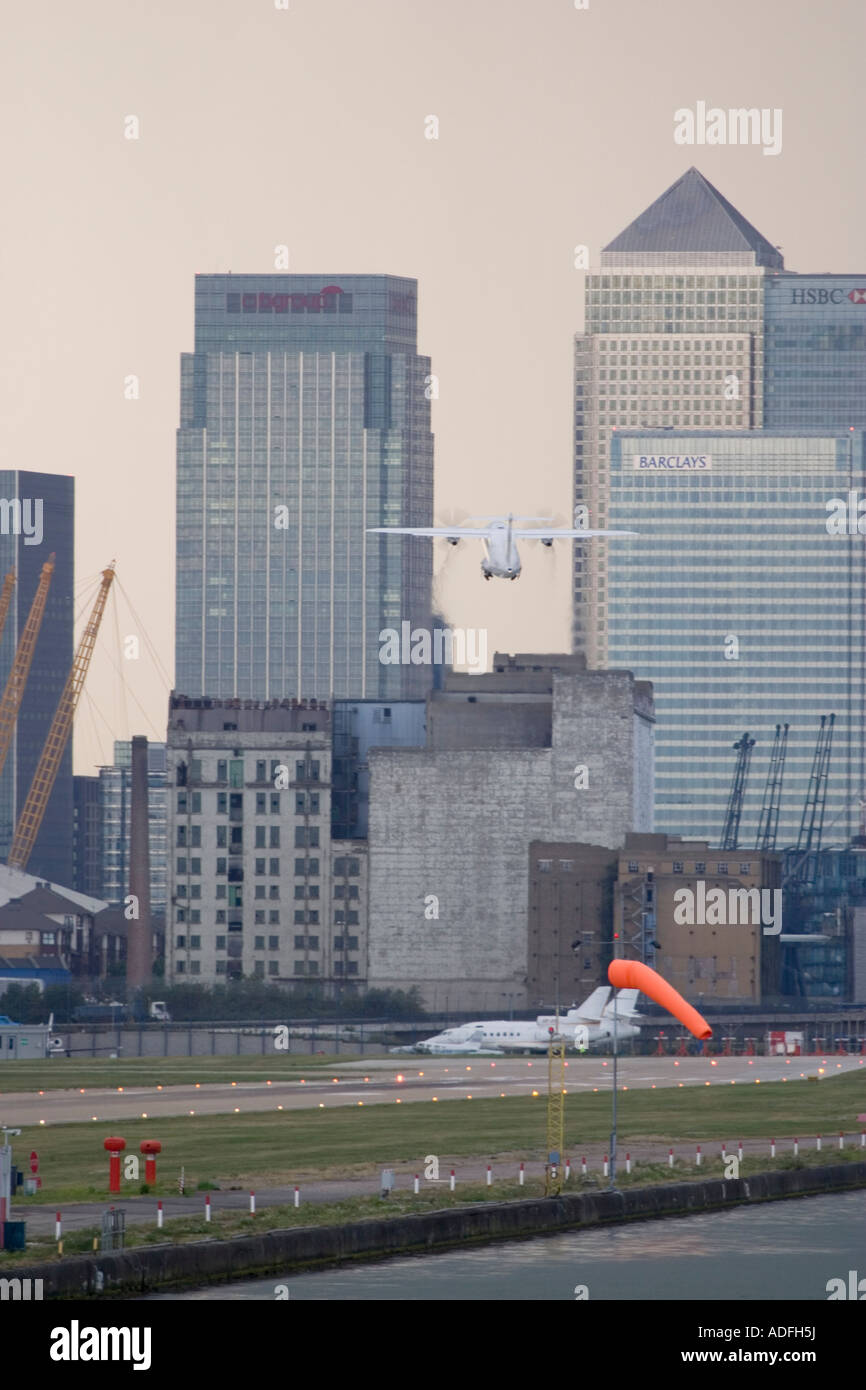 Regional turboprop aeroplane takeing off with strong crosswind from London City Airport UK Stock Photo