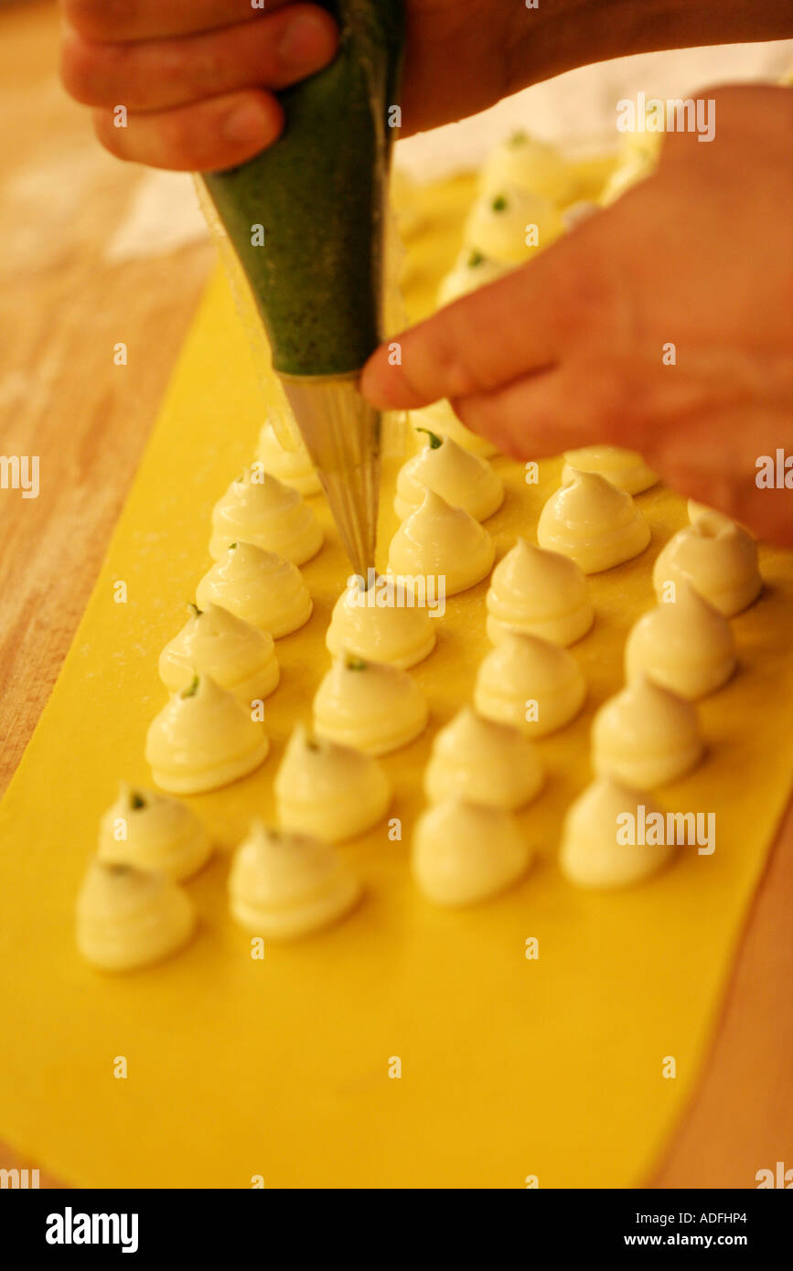 Preparation of Ravioli pasta with maionese and Salsa Verde sauce Cracco Peck restaurant Milan Lombardy Italy Stock Photo