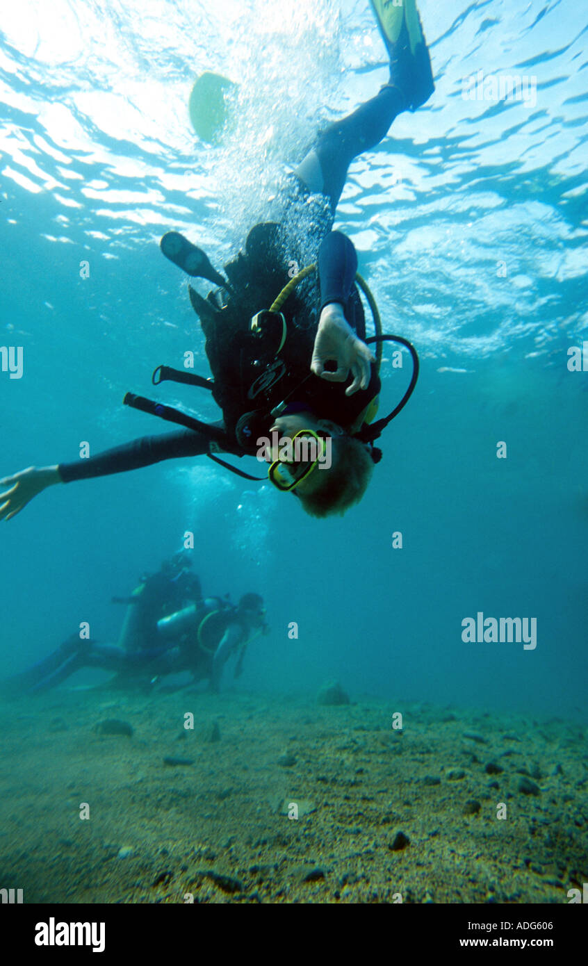 Teenage boy scuba diving in mid water Luke Hanna MR Stock Photo