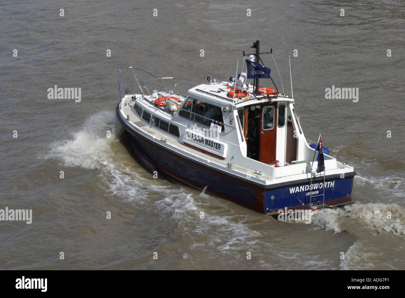London river Thames harbour master boat launch cruising along the