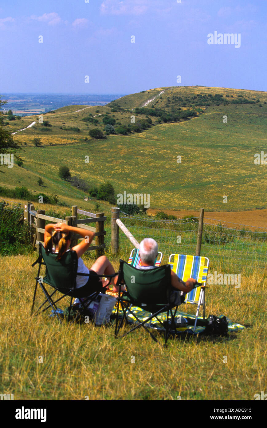 People Relaxing and looking out over Ivinghoe beacon Chilterns Buckinghamshire Stock Photo