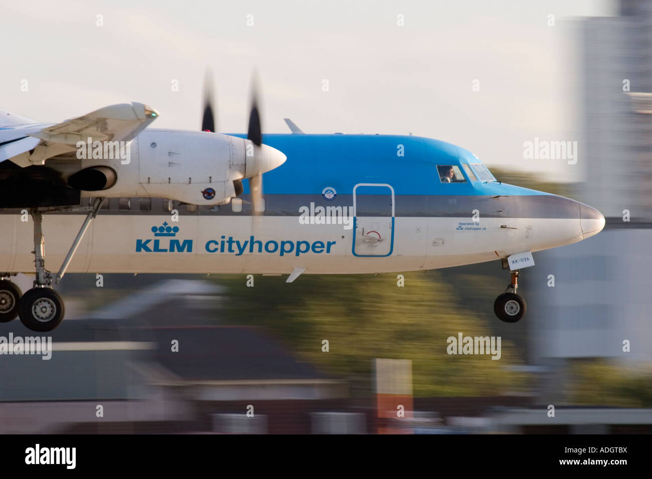 Close up of regional turboprop airplane Fokker 50 KLM about to land at London City Airport England UK Stock Photo