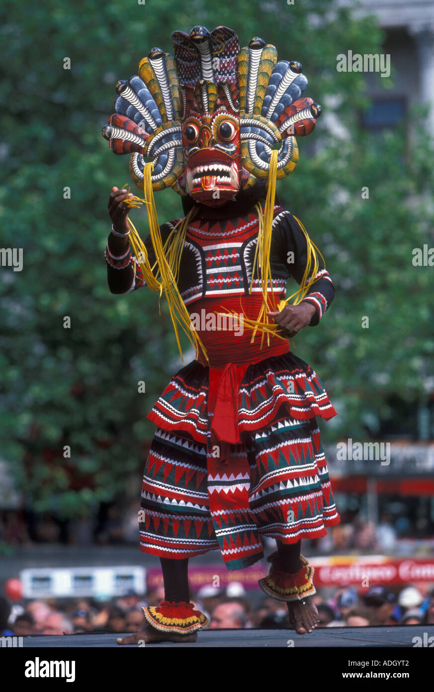 A dancer wearing a traditional Sri Lankan mask at a Festival in London Stock Photo