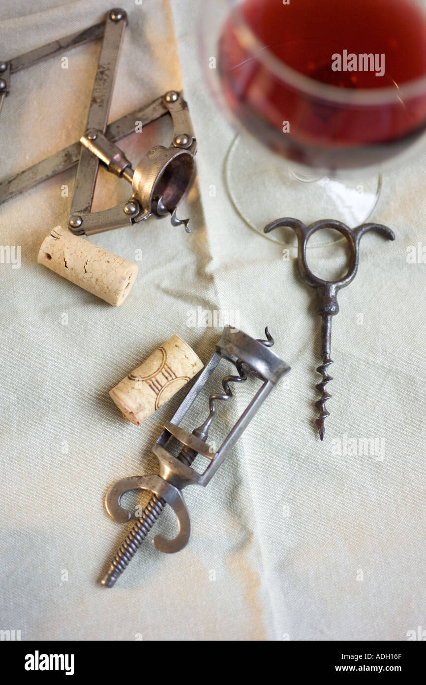 Still life of corkscrews and wine Stock Photo Alamy
