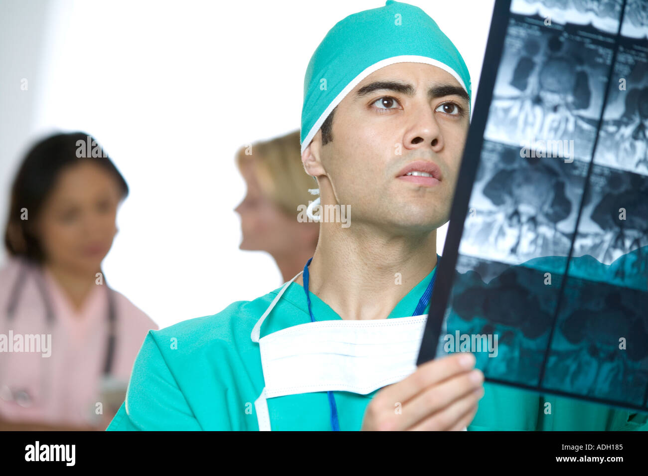 Doctor inspecting X rays Stock Photo