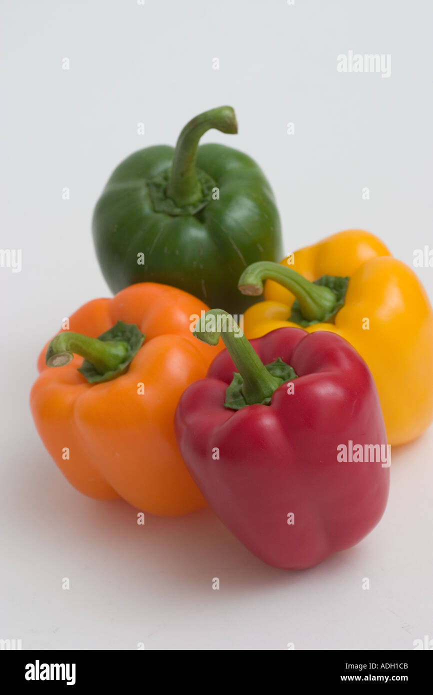 Group Colourful red green orange yellow bell peppers Stock Photo