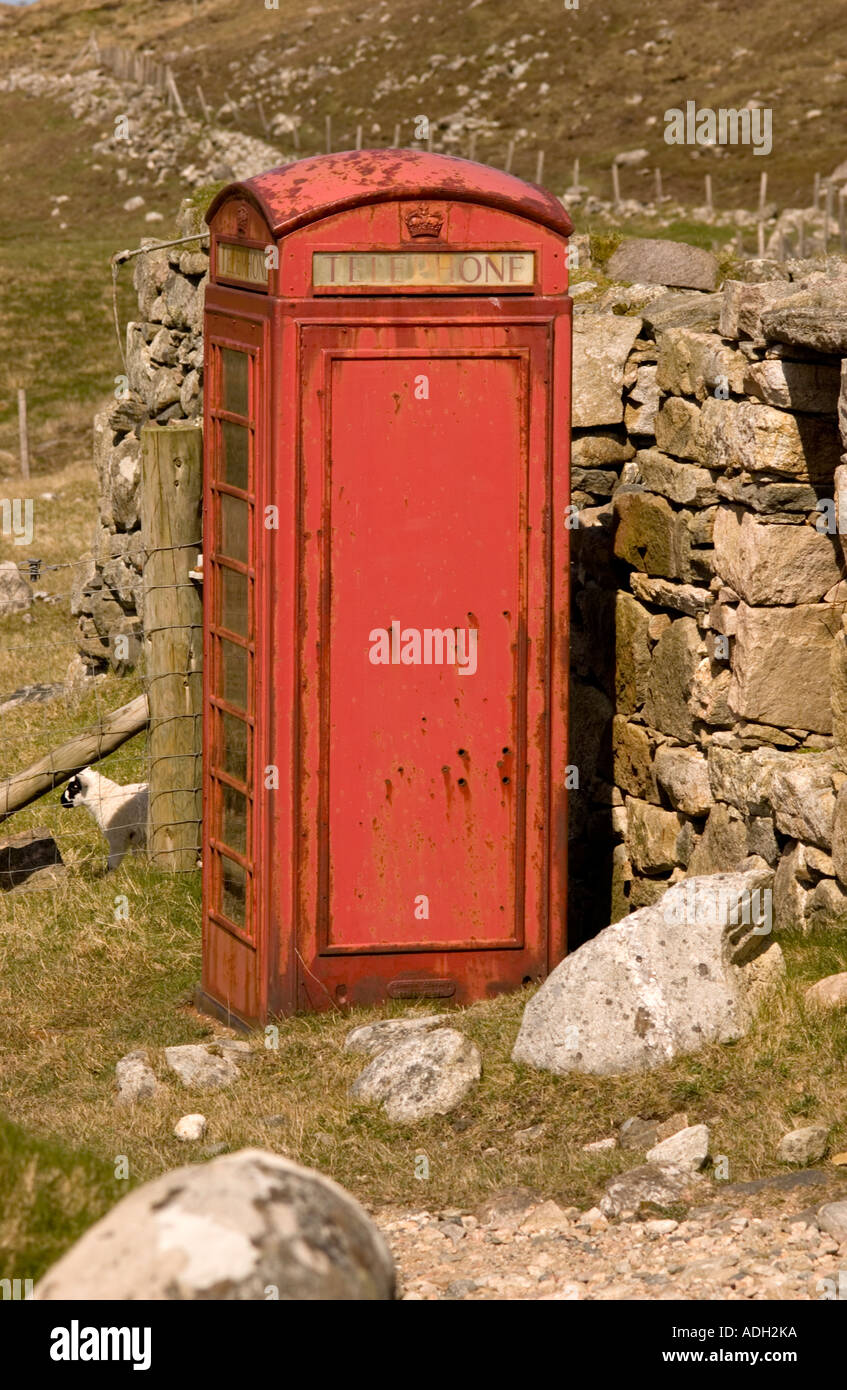 British telephone box still with connection, in rural setting in Isle of Lewis, Outer Hebrides, Scotland, UK Stock Photo