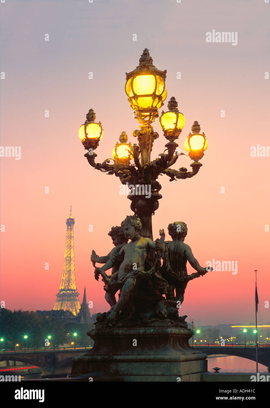 France Paris Pont Alexandre III Eiffel Tower Laterne angel sculptures at dusk Stock Photo