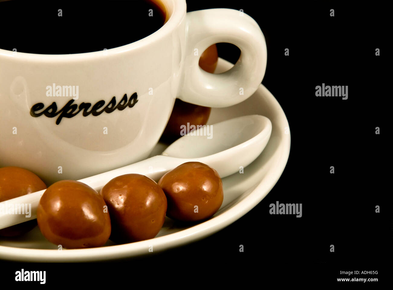 Cup of coffee espresso with sweeties. Stock Photo