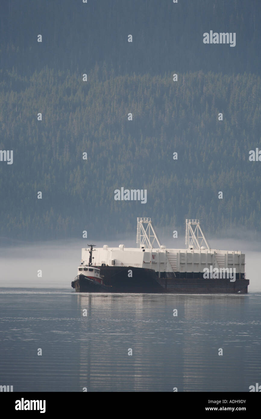 Tugboat and bulk cargo barge heading for Rio Tinto/Alcan aluminum smelter Kitimat British Columbia Stock Photo