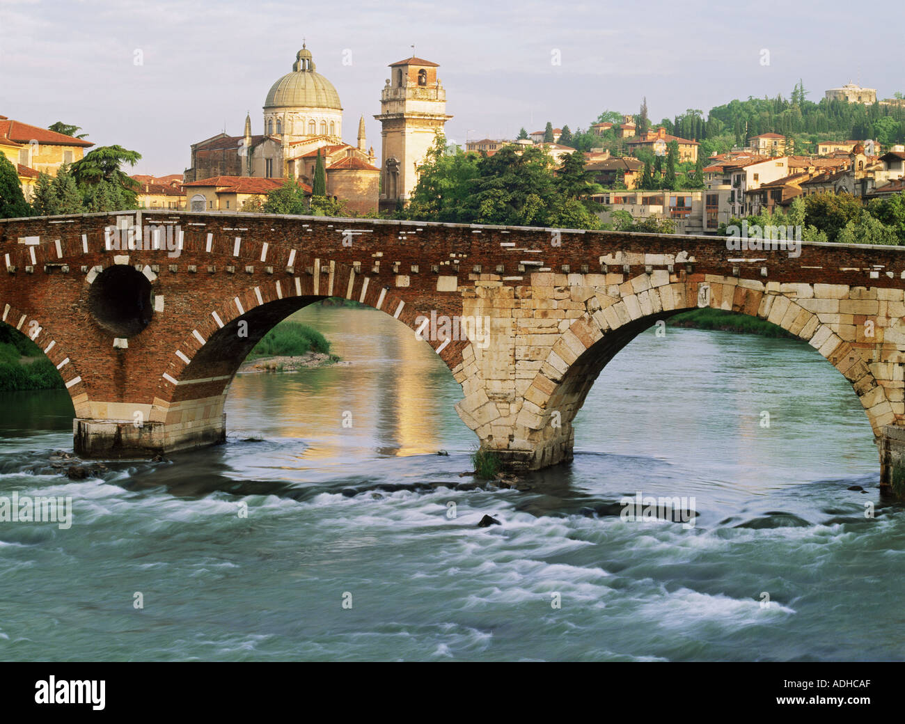 Pietra Bridge over Adige River with San Giorgio Cathedral beyond in Verona, Italy Stock Photo