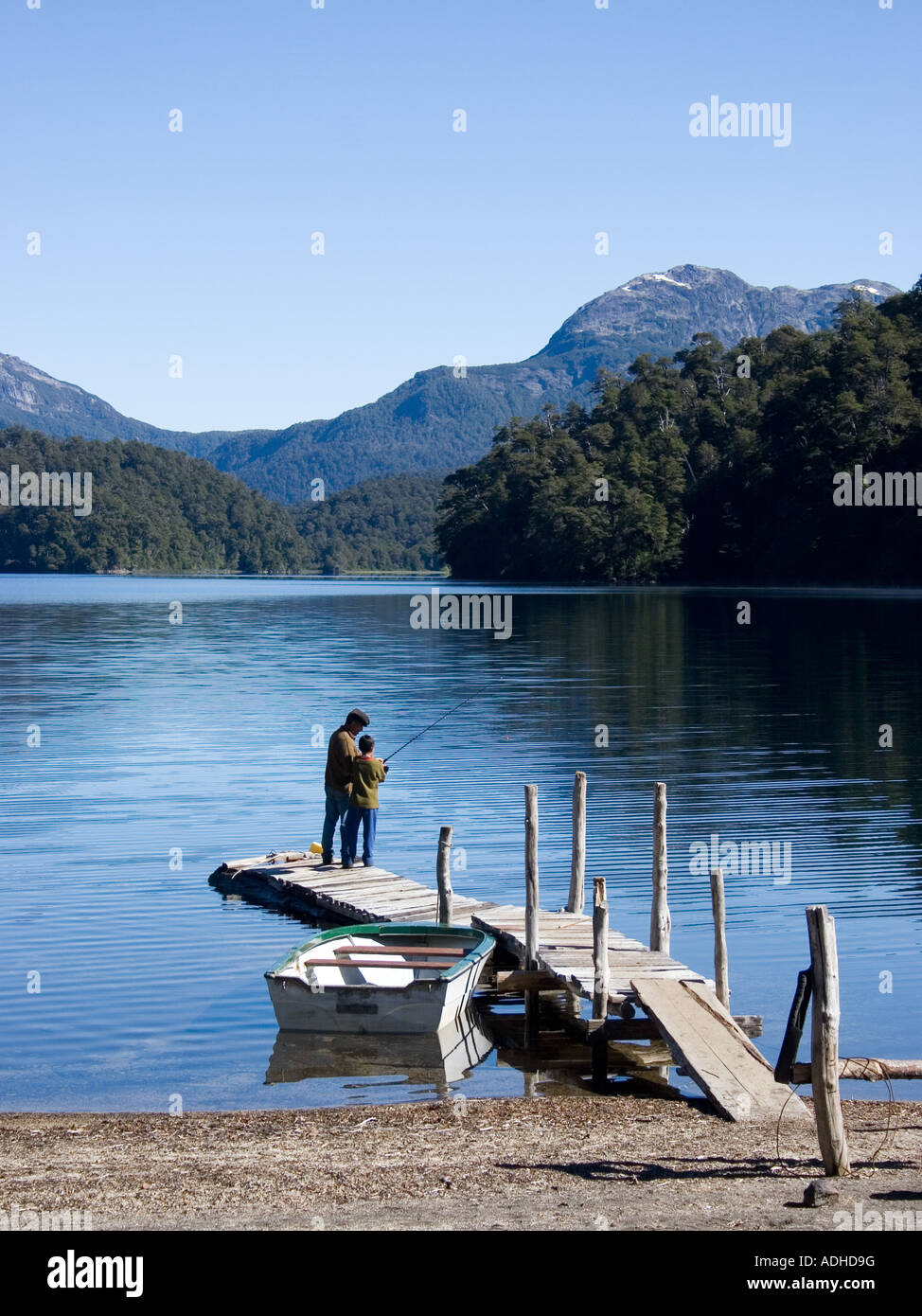 Father teaching his son how to fish Stock Photo - Alamy