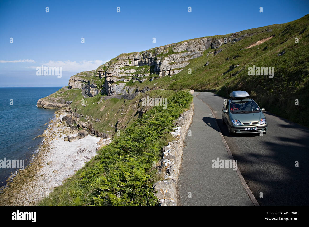 Woman driving car on Marine Drive around the coast of Great Orme