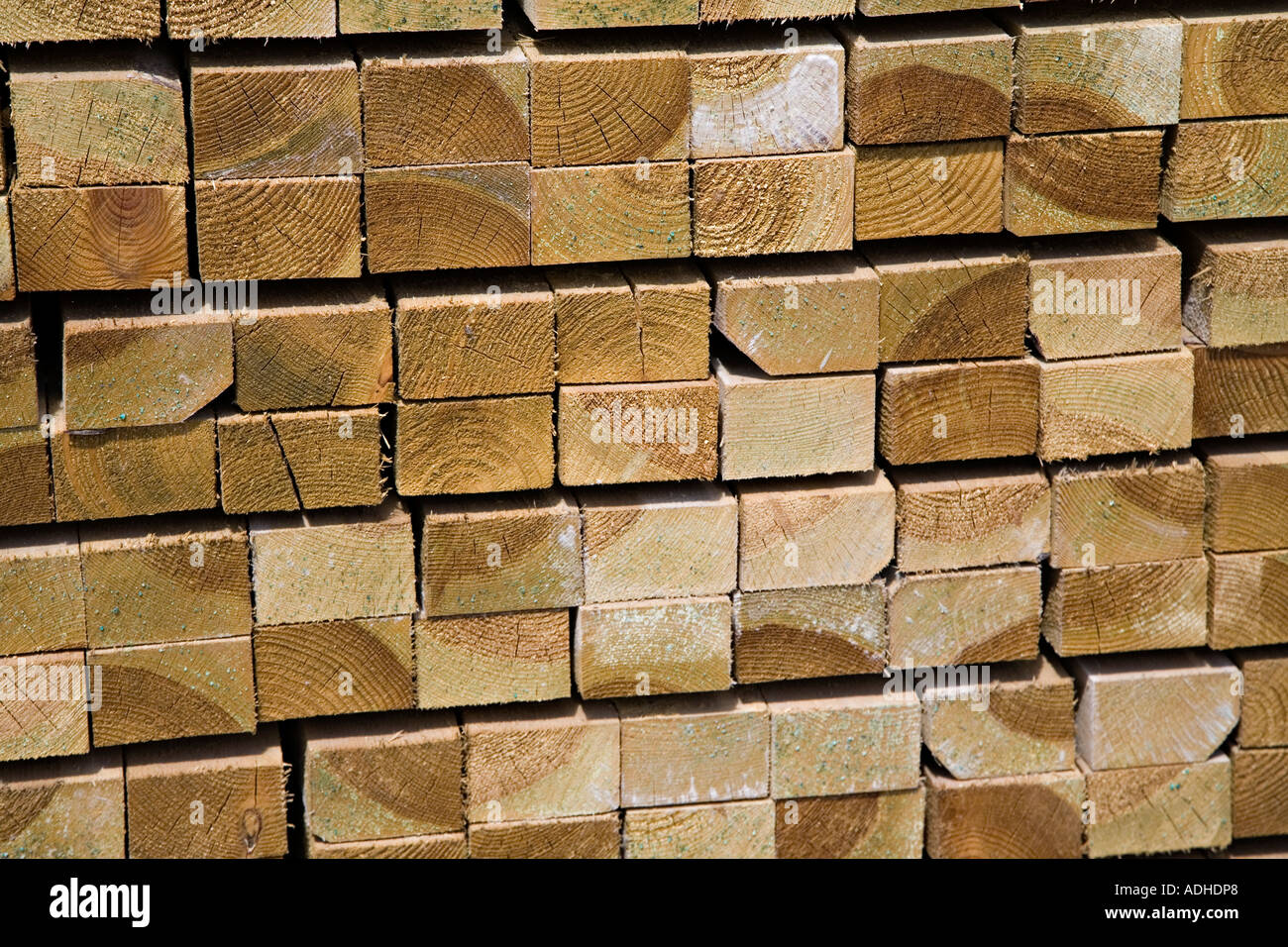 Stack of tannalised wood at a builders merchant Wales UK Stock Photo