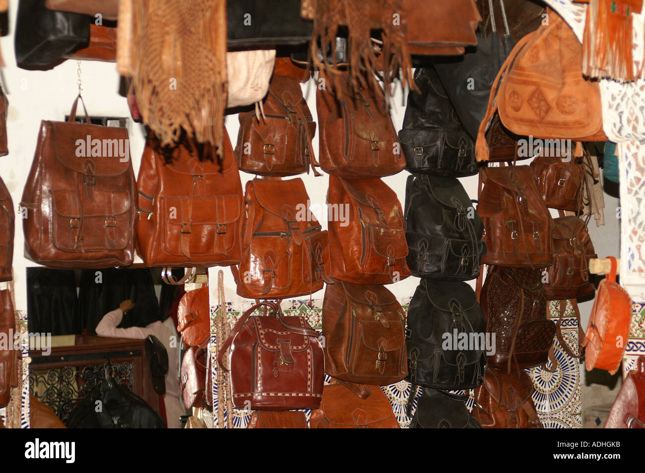 Leather bags and handbags hanging in a shop in the Souk Fes Morocco