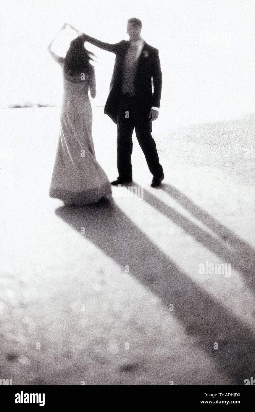 Young couple dancing on the beach Stock Photo - Alamy