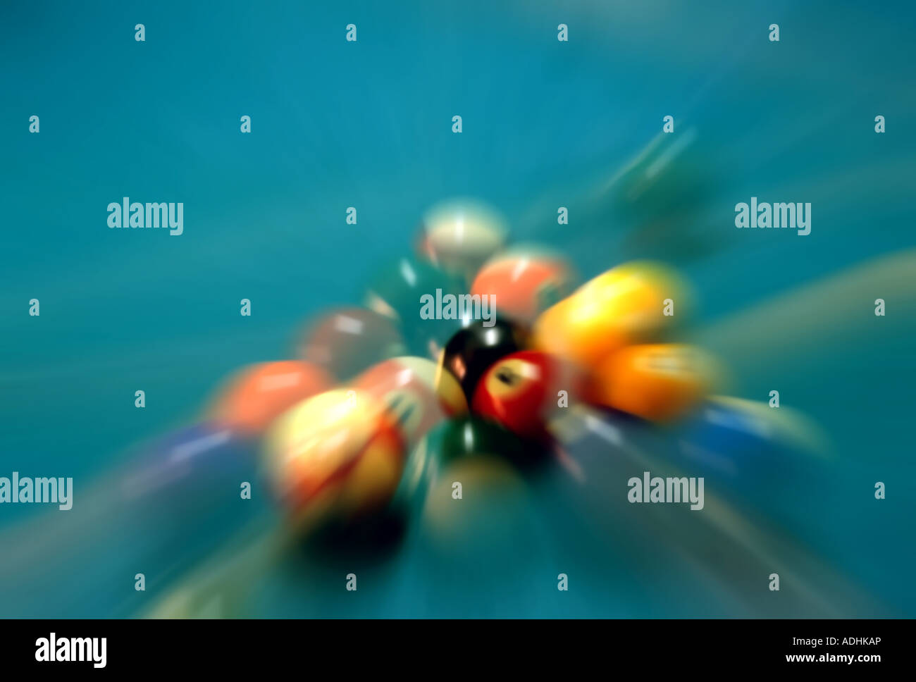 A zoomed and blurred image of a pool ball break filled with movement
