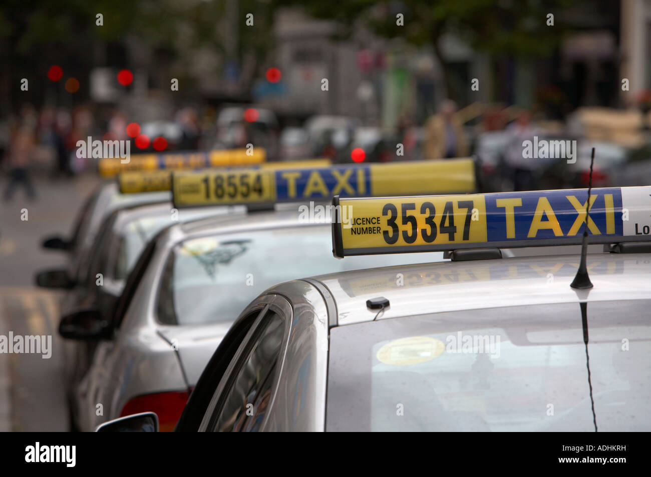 row of taxi cab signs on a taxi rank in the centre of dublin Stock