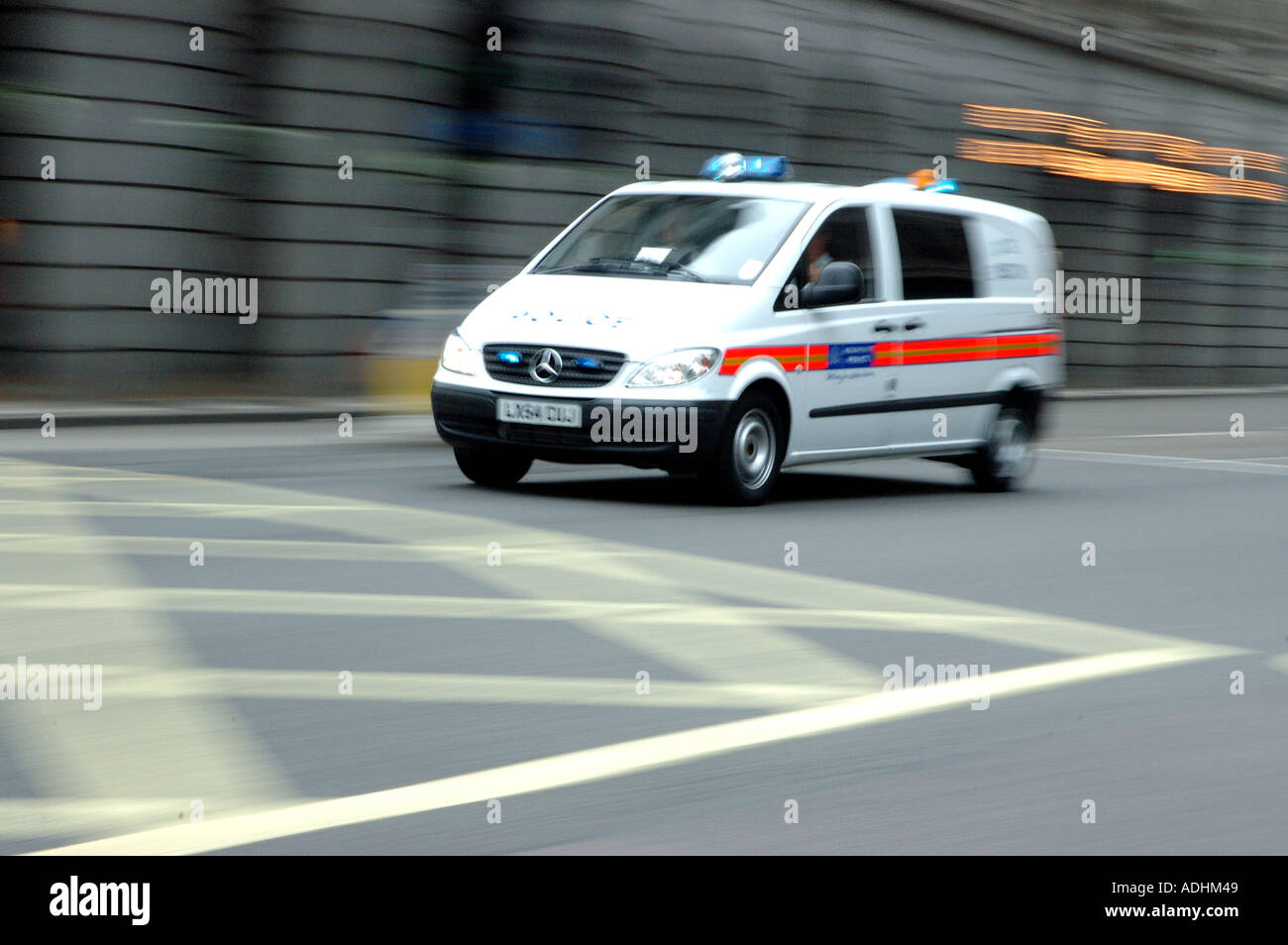 Police Riot Van racing through the streets of london afetr the London bombings Stock Photo