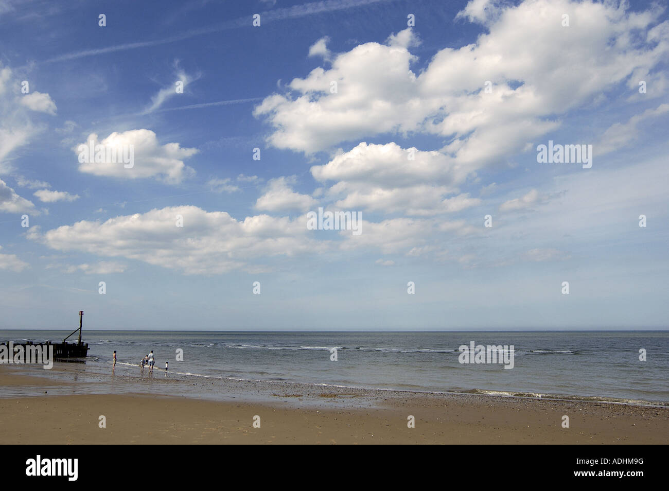 Big sky and breakwater at Happisburg Beach Norfolk Stock Photo